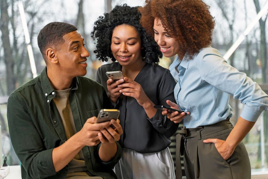 small group of adults text messaging